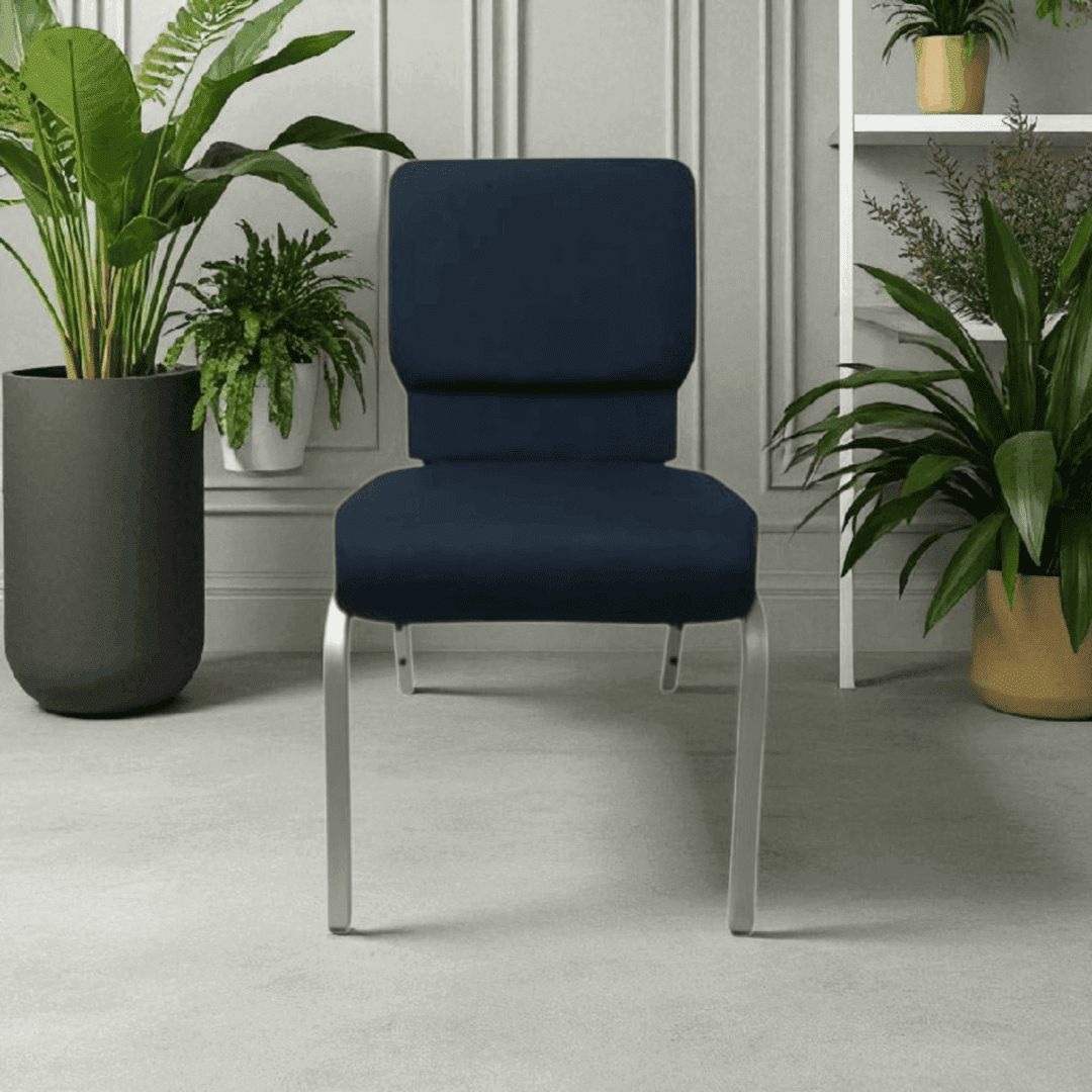 Modern navy blue chair with metal legs between indoor plants.
