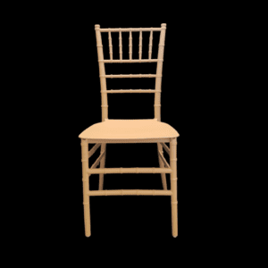 A simple wooden chair with a natural finish against a black background.
