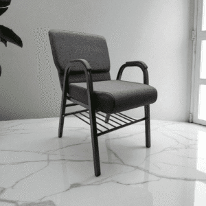 Gray chair on marble floor near window.